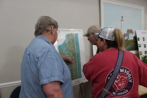 Council Member Benn showing residents the vertical benchmark map